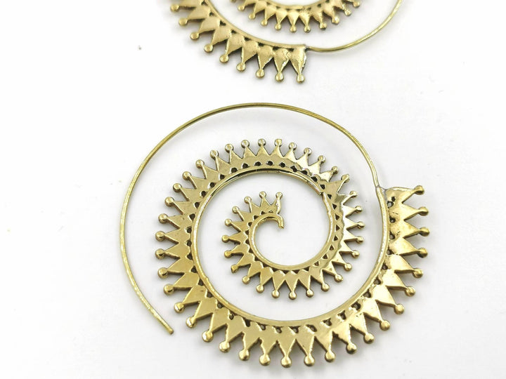 Boho Spiral Earrings with Sun Pattern — Brass