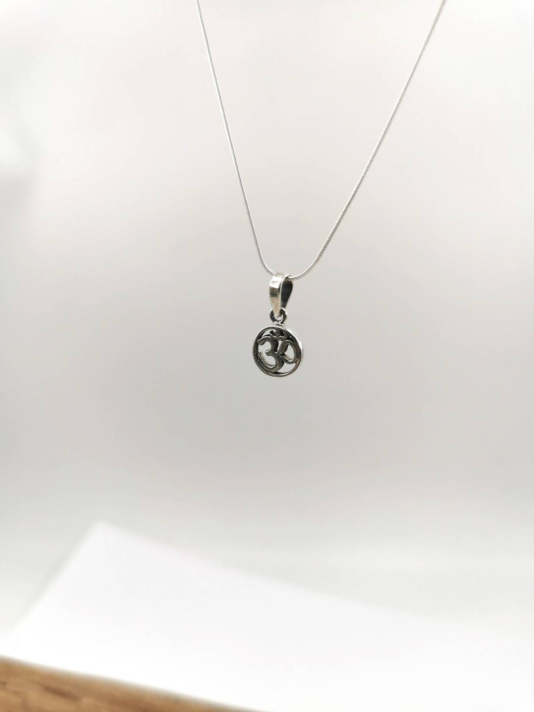 Tiny Circular Om Charm — 925 Silver